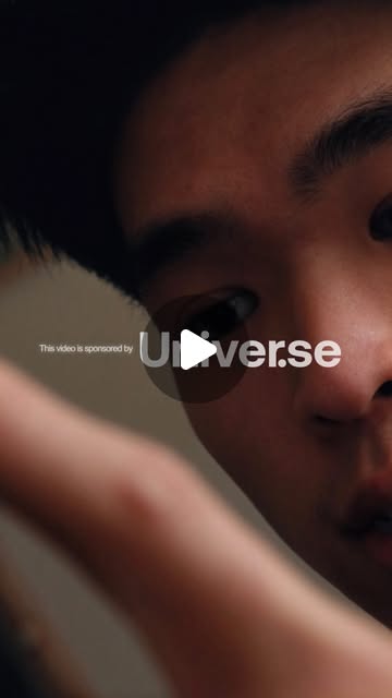 Jing Xian leaning towards the camera with a Universe sponsorship credit over the image.